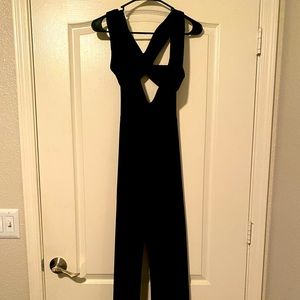 Woman’s black jumpsuit never worn